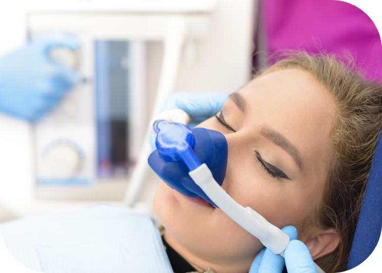 Asleep patient's face with nitrous mask over their nose